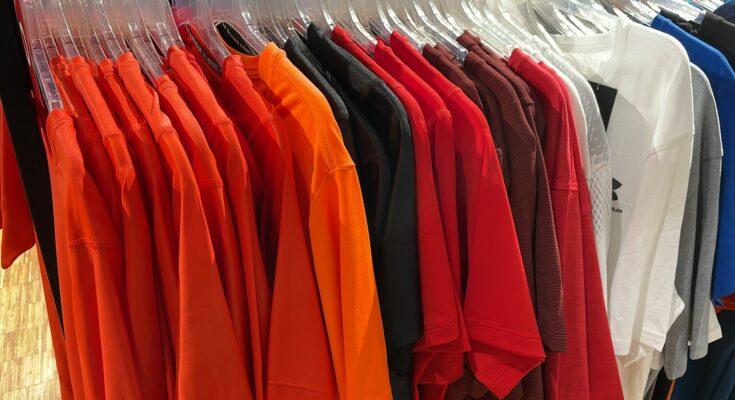 a rack of shirts hanging in a store